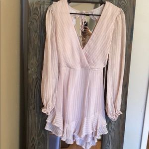 Pink ruffle bottom dress with open back